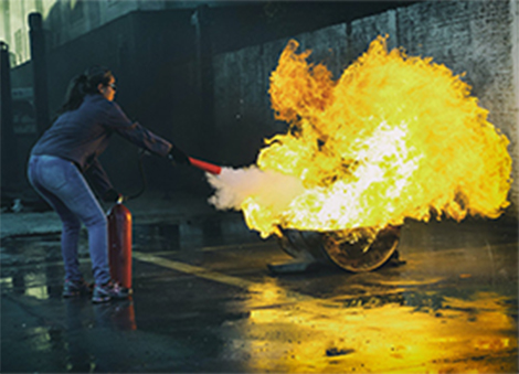 Sweep from side to side at the base of the fire